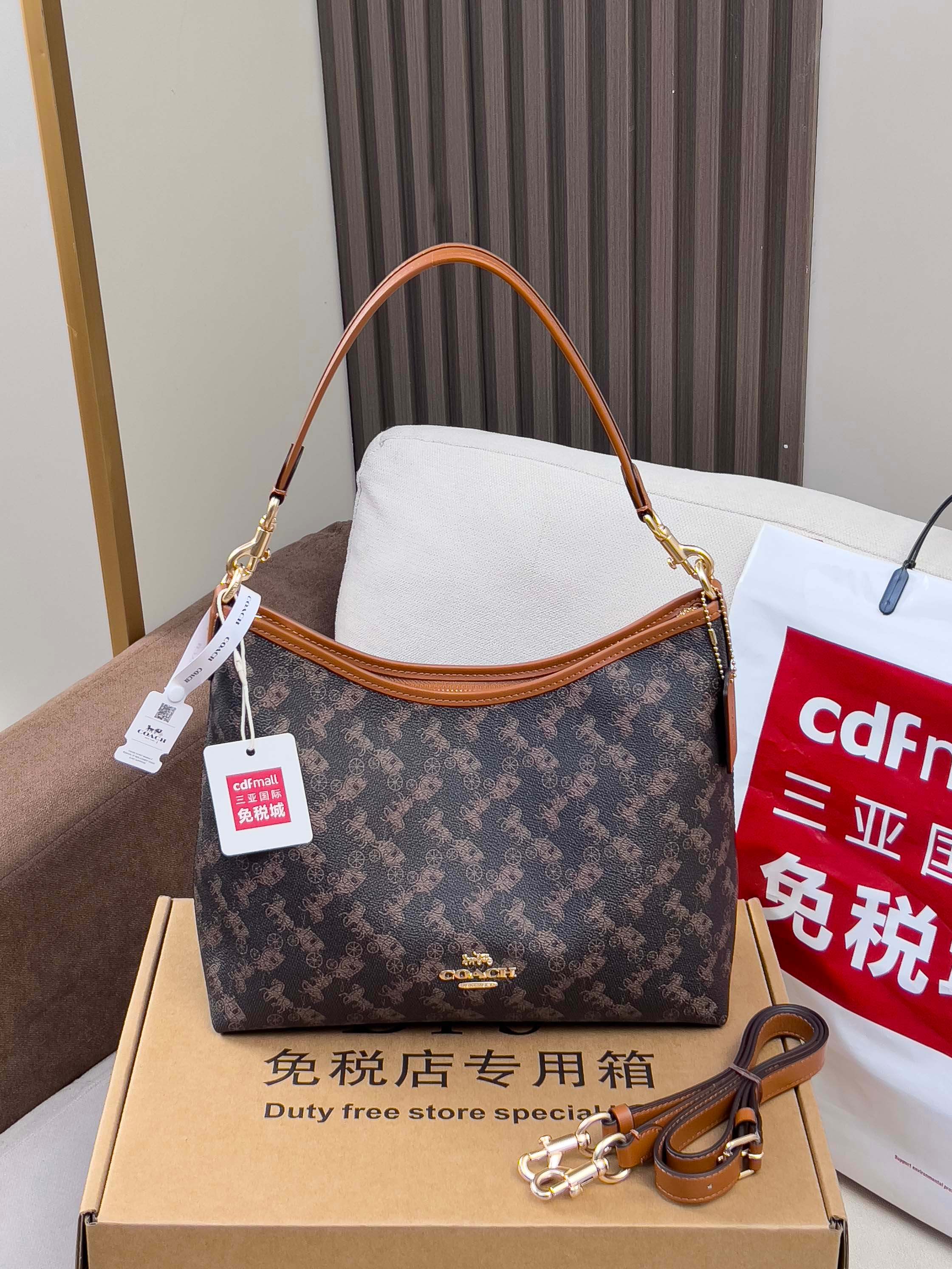 Coah monogram shoulder bag with tan handles and gold-tone hardware