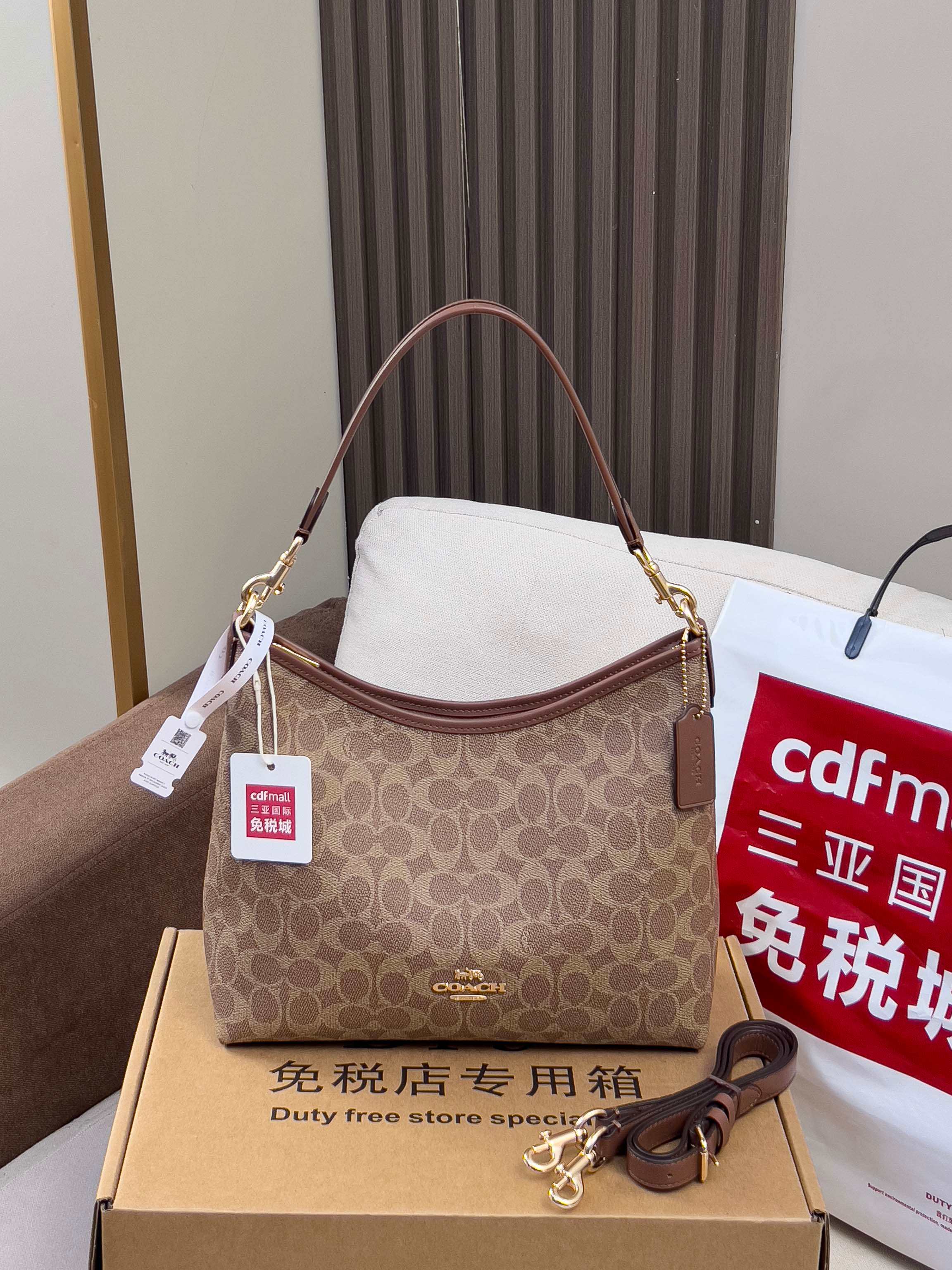 Brown monogram handbag with thin strap and gold-tone hardware
