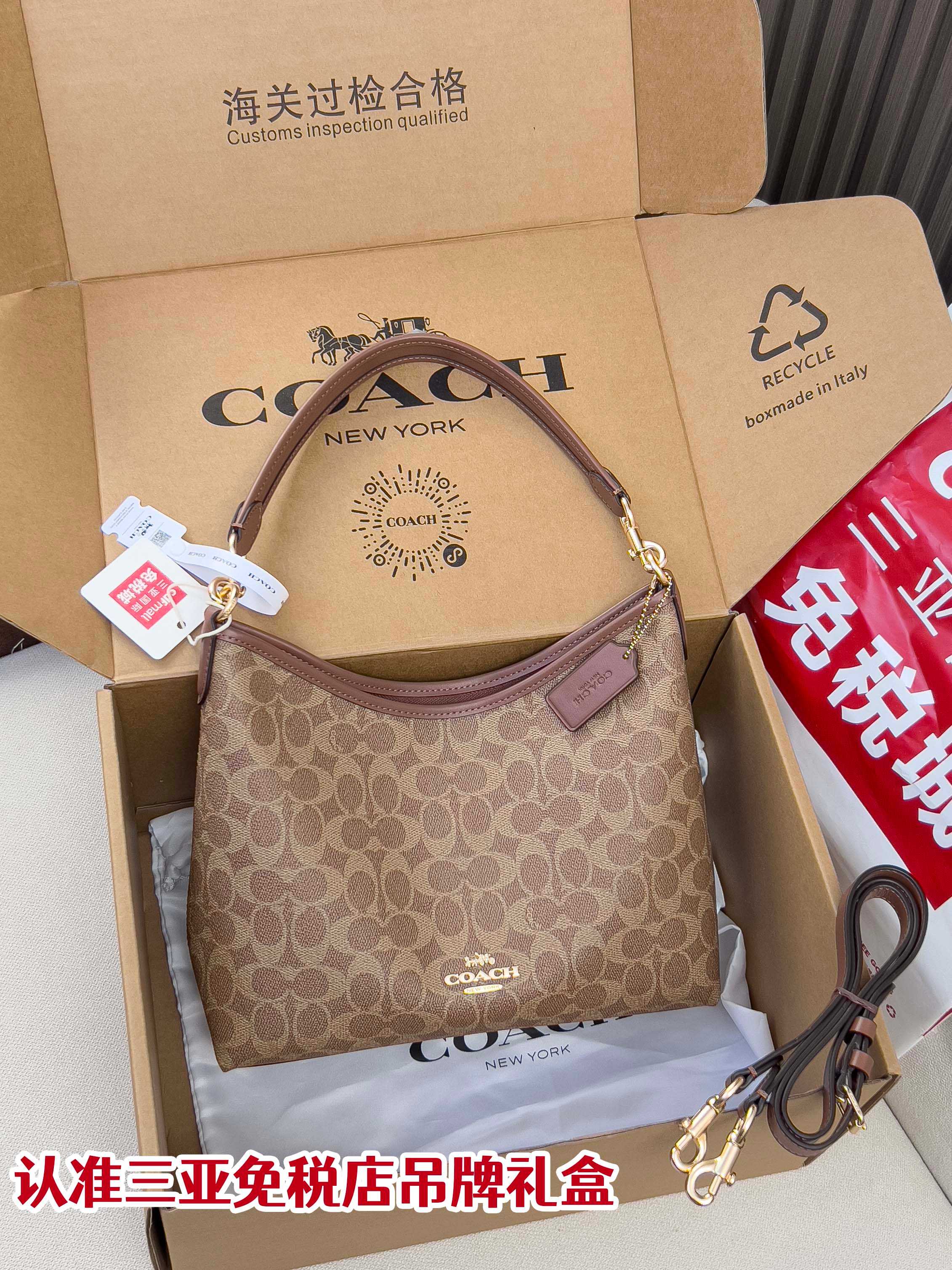 Brown monogram crossbody bag with top zip and adjustable shoulder strap