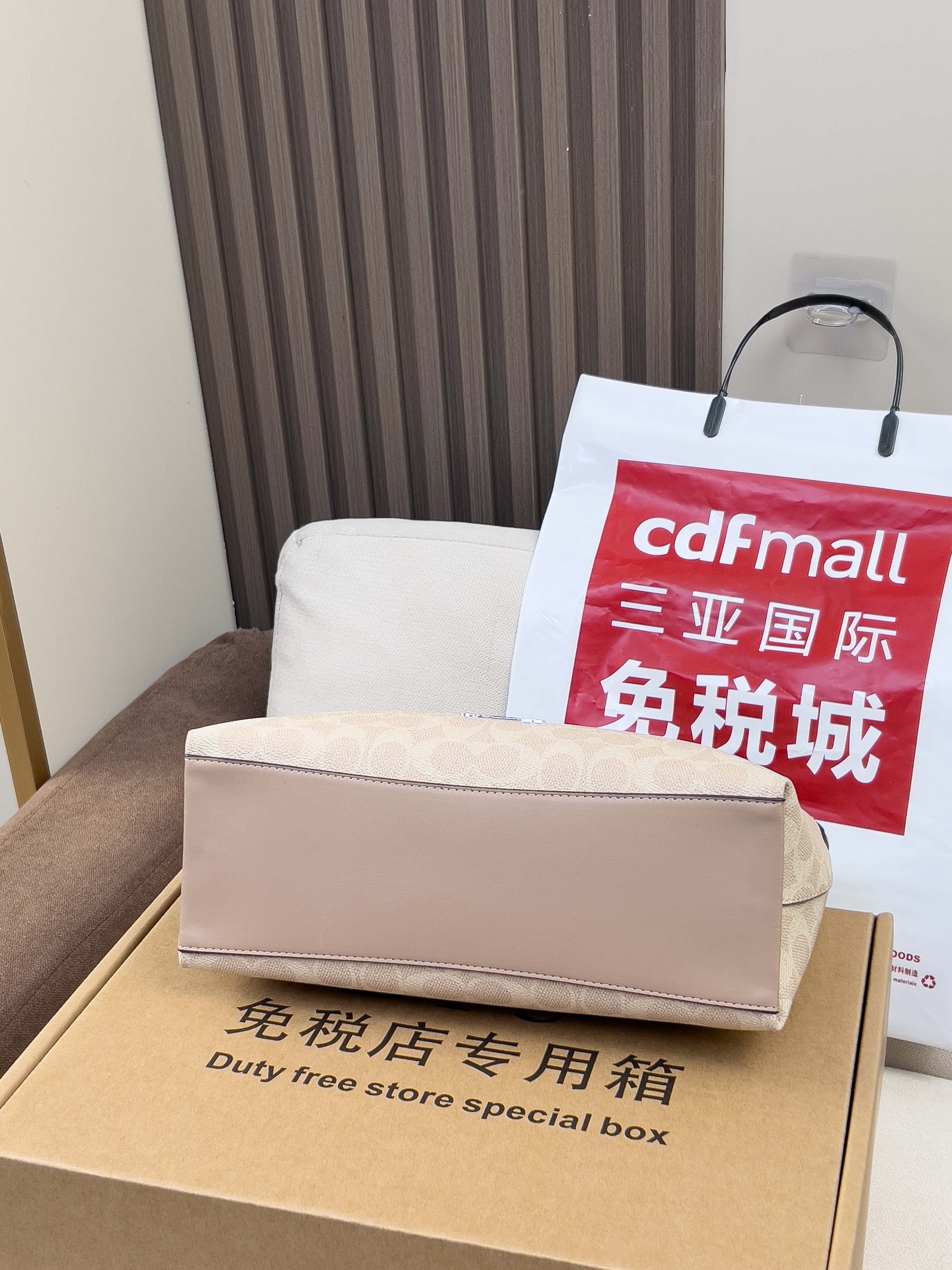 Coah bag duty-free store special box with DFS text and white shopping bag