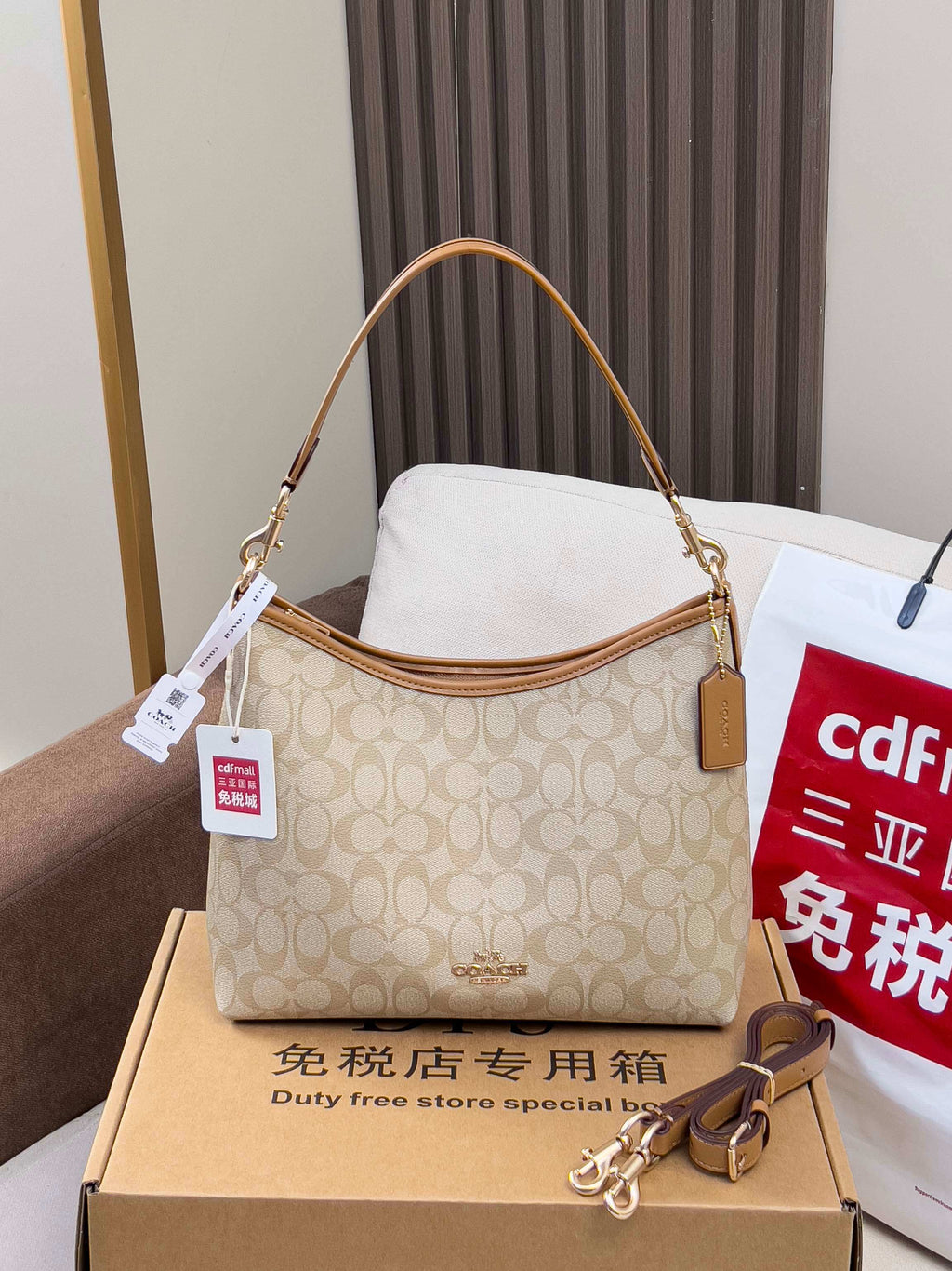 Coach signature shoulder bag, light tan monogram with tan trim, zip top.