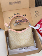 Beige monogram hobo bag with pink strap and zip closure