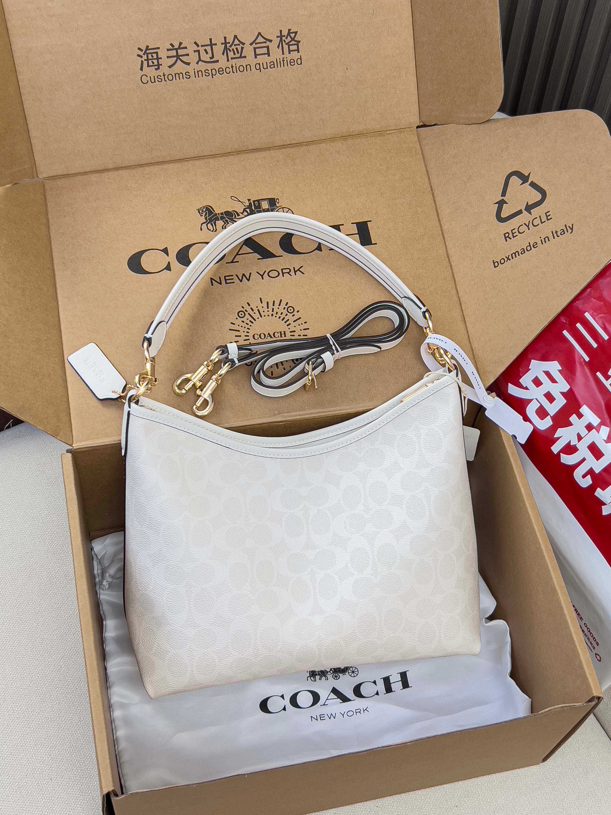 Coah handbag, light gray patterned canvas, hobo shape with chain shoulder strap