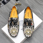 Printed loafers with gold emblem medallion and black strap detail