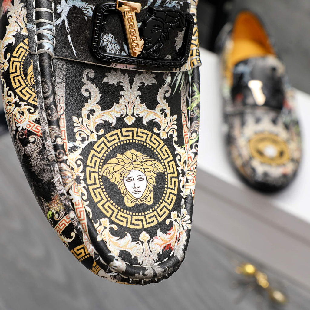 Loafers upper close-up with Medusa portrait and ornate black-and-white pattern