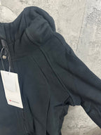 Dark hoodie shoulder and sleeve with hood seam detail