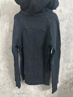 Dark zip-up hoodie with hood and kangaroo pocket, back view