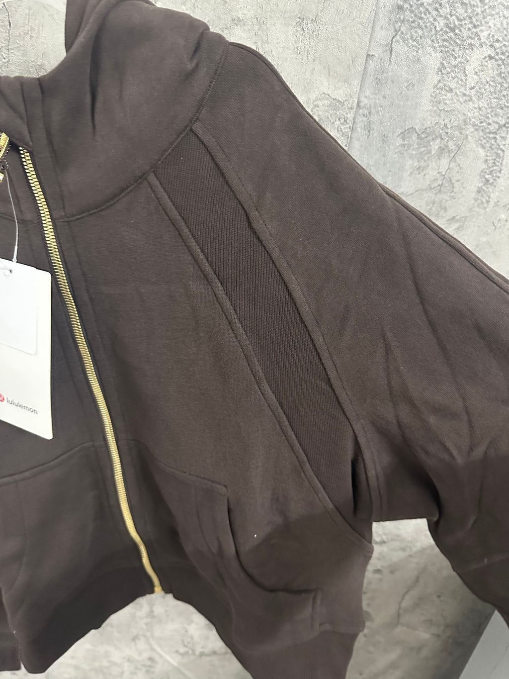 Ralph Lauren zip-up hoodie sleeve and front seam details in dark charcoal