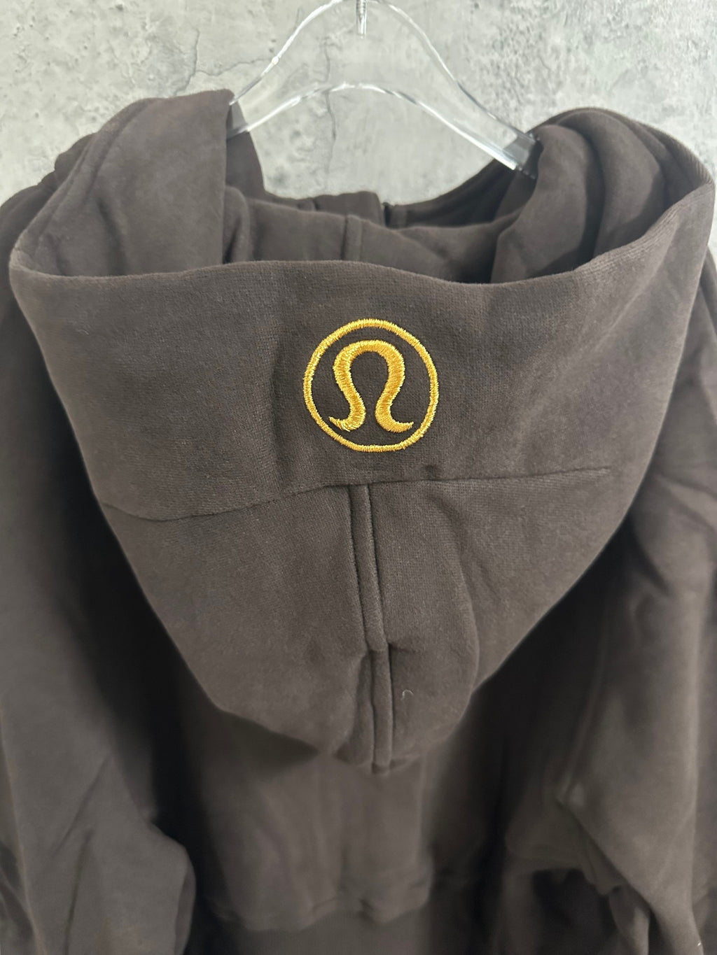 Ralph Lauren hooded sweatshirt with lululemon logo badge on hood, dark charcoal