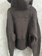 Dark zip-up hoodie back view with hood and seam details