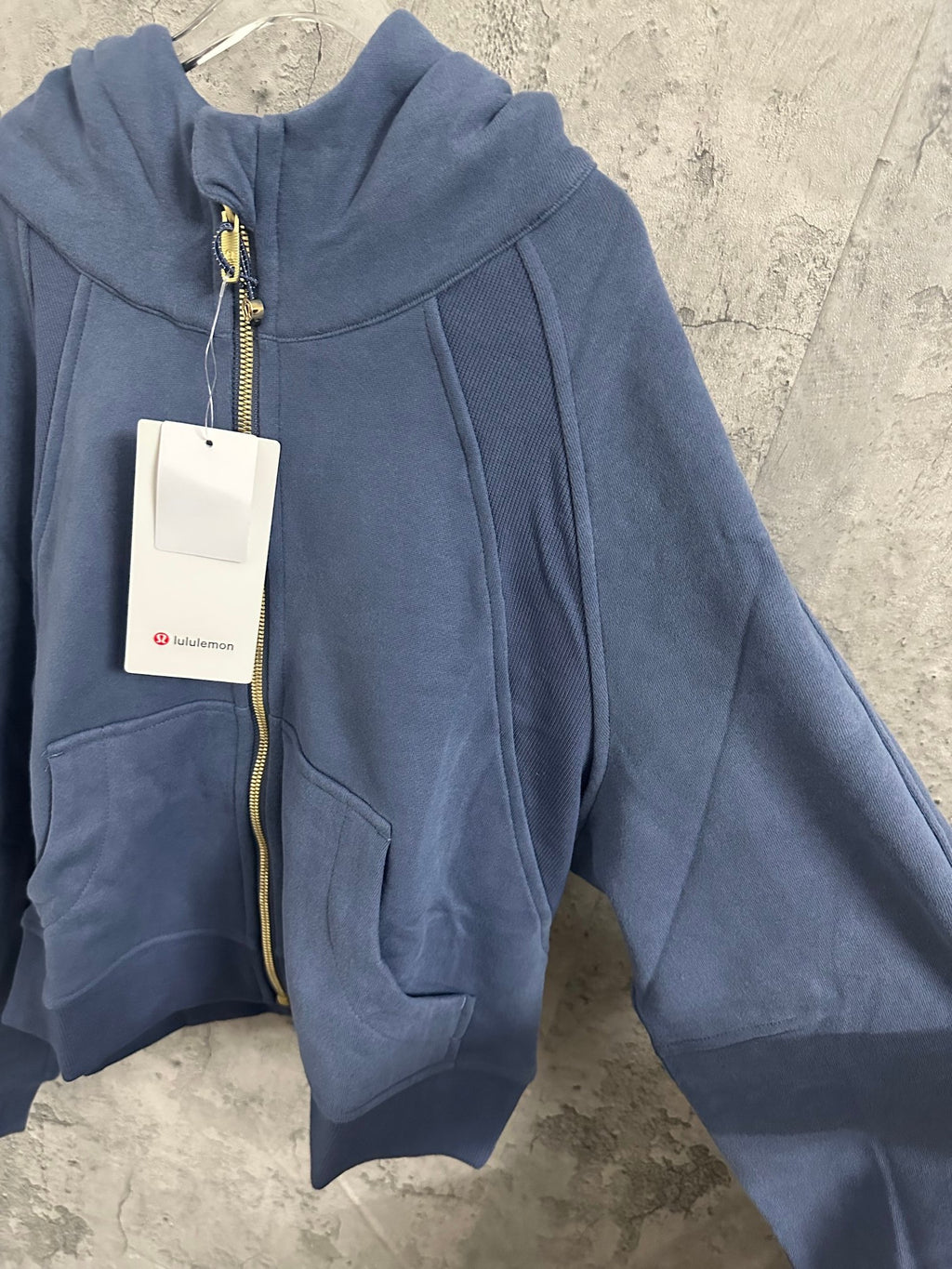 Ralph Lauren blue zip-up hoodie with hood, front zip, and kangaroo pockets