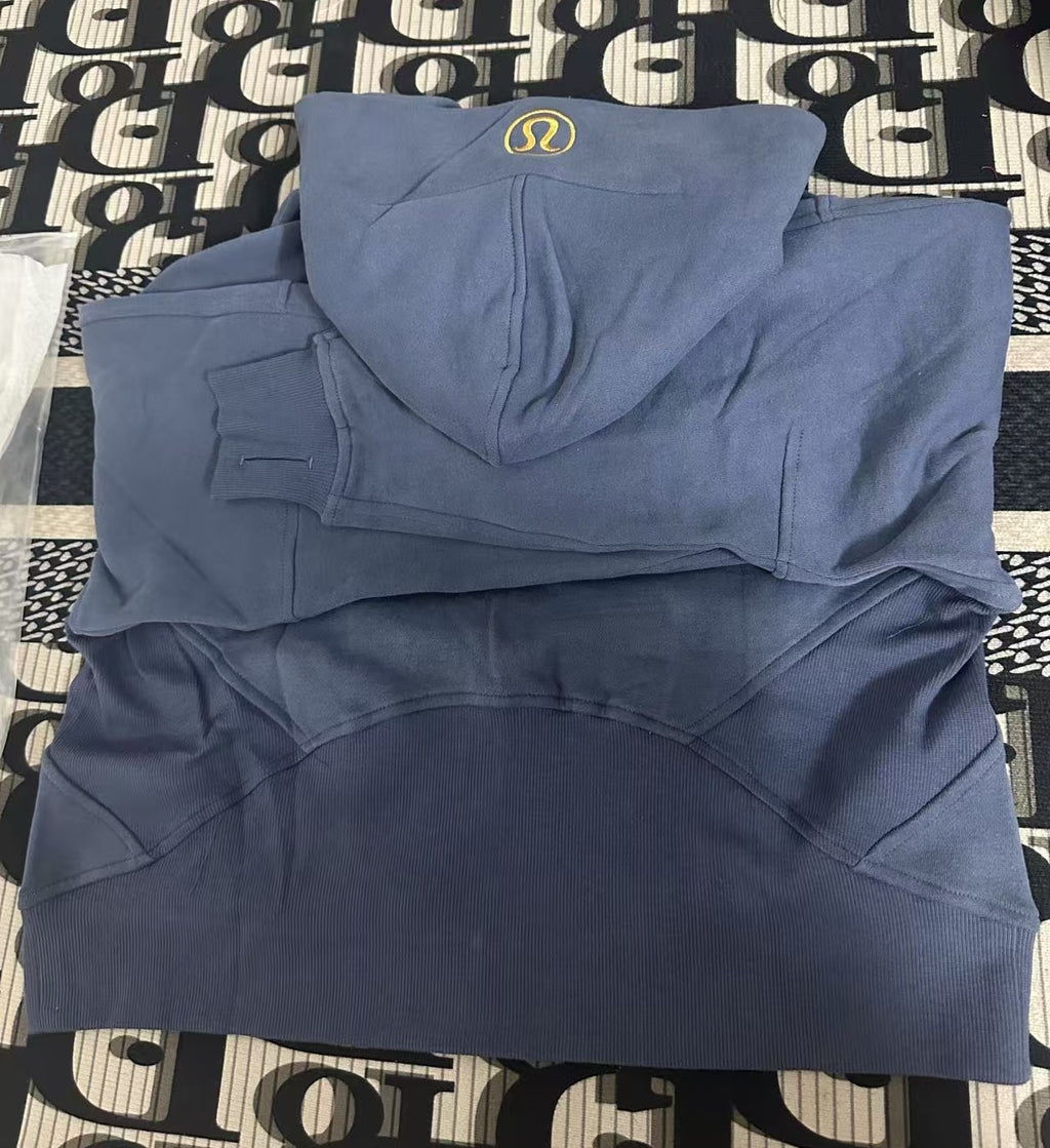 Ralph Lauren blue hoodie folded on patterned fabric