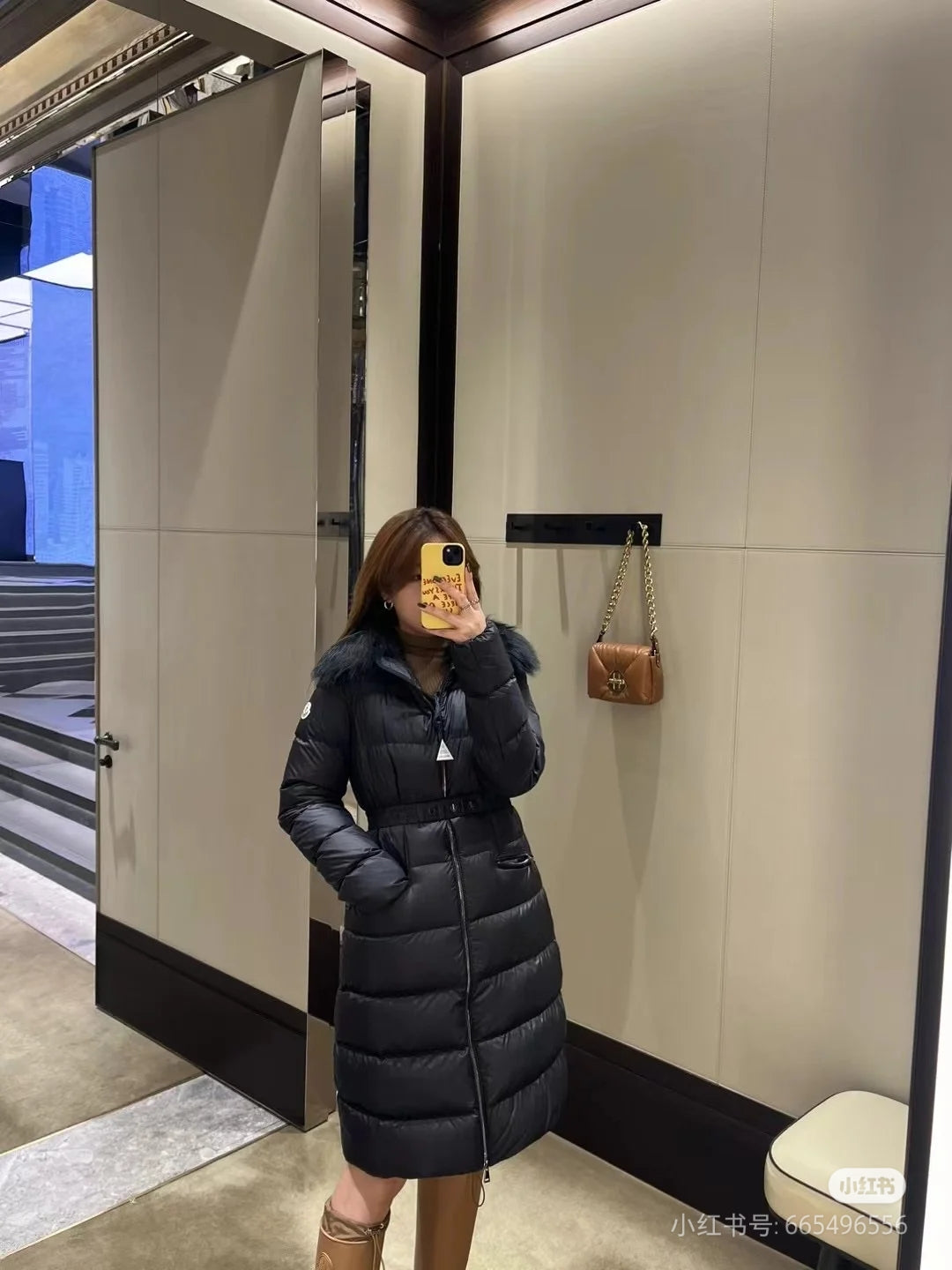 Moncler long puffer coat with faux fur hood, dark color, knee-length
