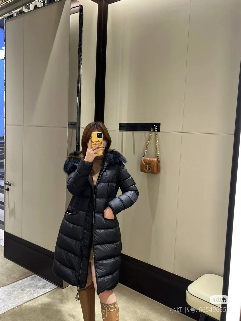 Moncler long puffer coat with faux fur hood, dark color, belted fit