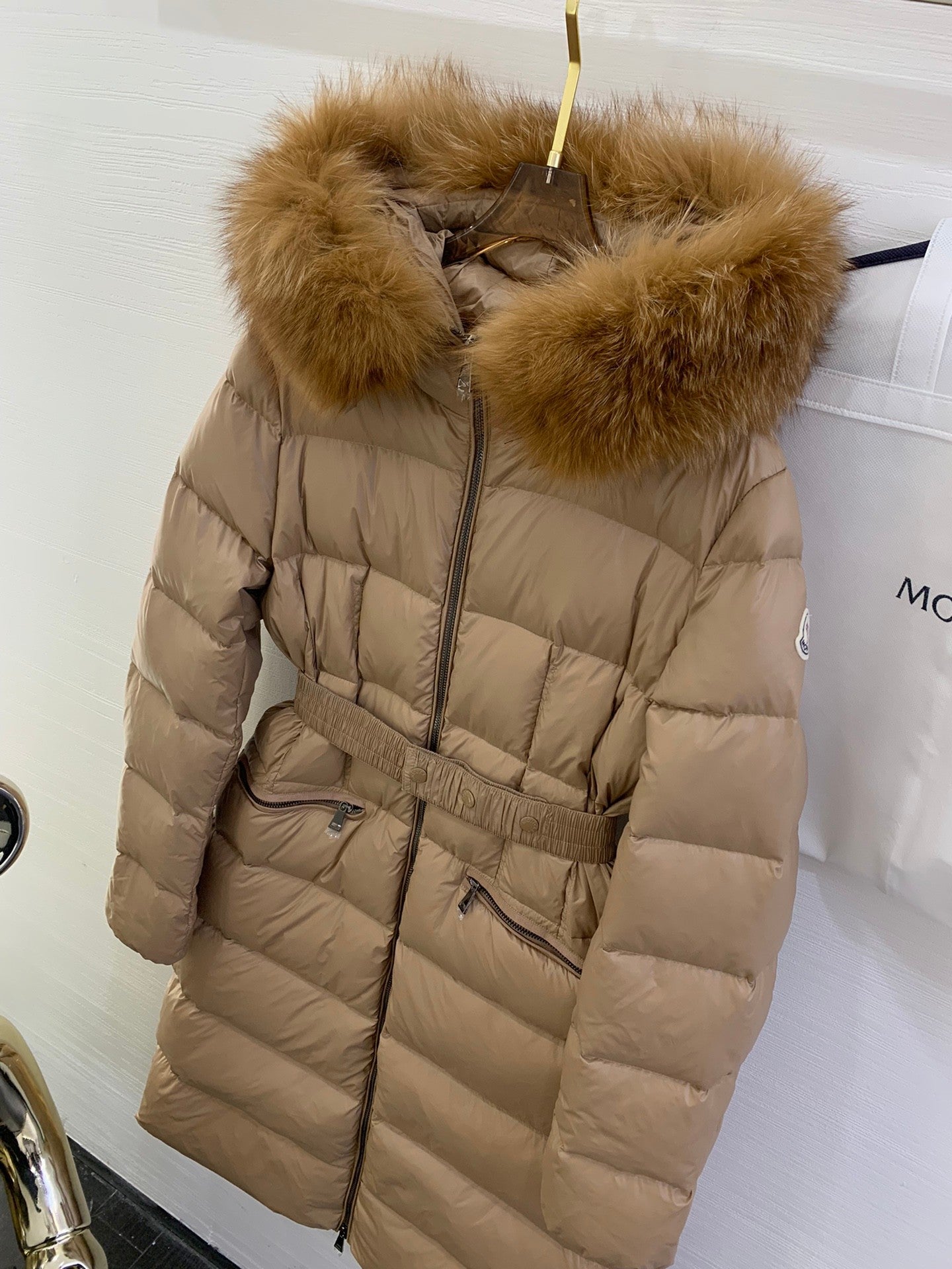 Moncler long quilted puffer coat with fur-trim hood and belt, tan