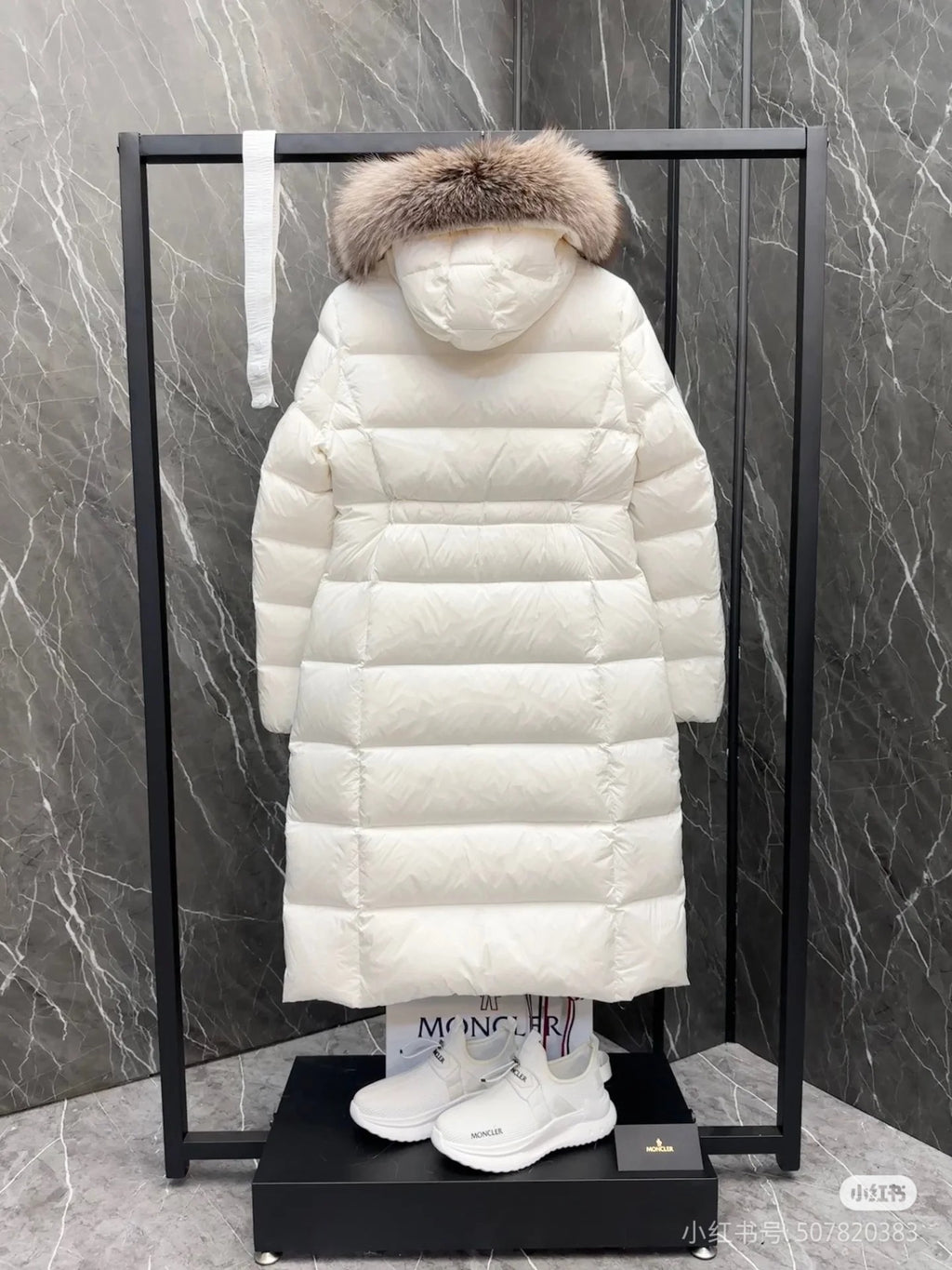 Long white puffer coat with faux fur hood, quilted back view