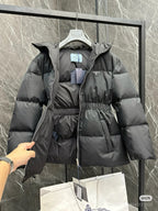 Dark puffer jacket with hood, full zip, cinched waist, logo patch