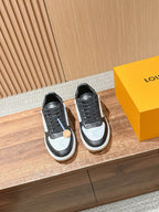 Low-top Louis Vuitton sneakers, black and white leather with lace-up design and logo