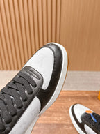 Louis Vuitton sneaker toe and lace area, black laces on white leather with gray trim