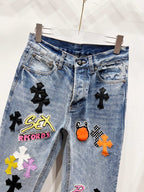 Light blue Chrome pants with black cross patches and embroidered logo graphic on front