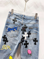 Light blue Chrome pants with black cross patches, pocket patch graphics, and pink face patch