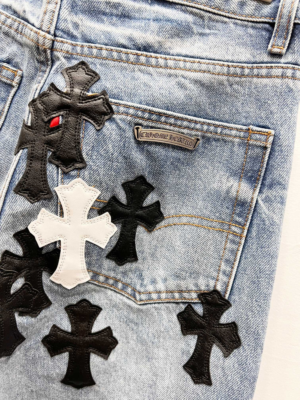 Light blue Chrome pants pocket with black star patch appliques and small label patch