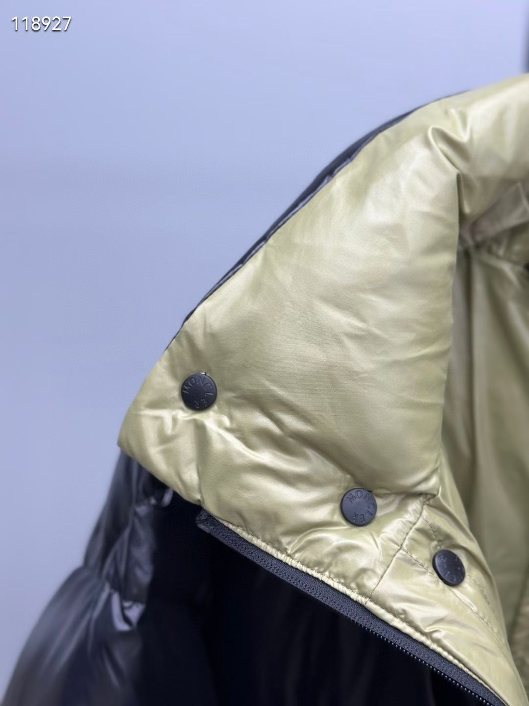 Neon green hood lining with button details on long puffer jacket
