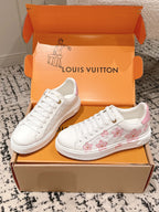 Louis Vuitton white sneakers with pink floral print on side and white lace-up design