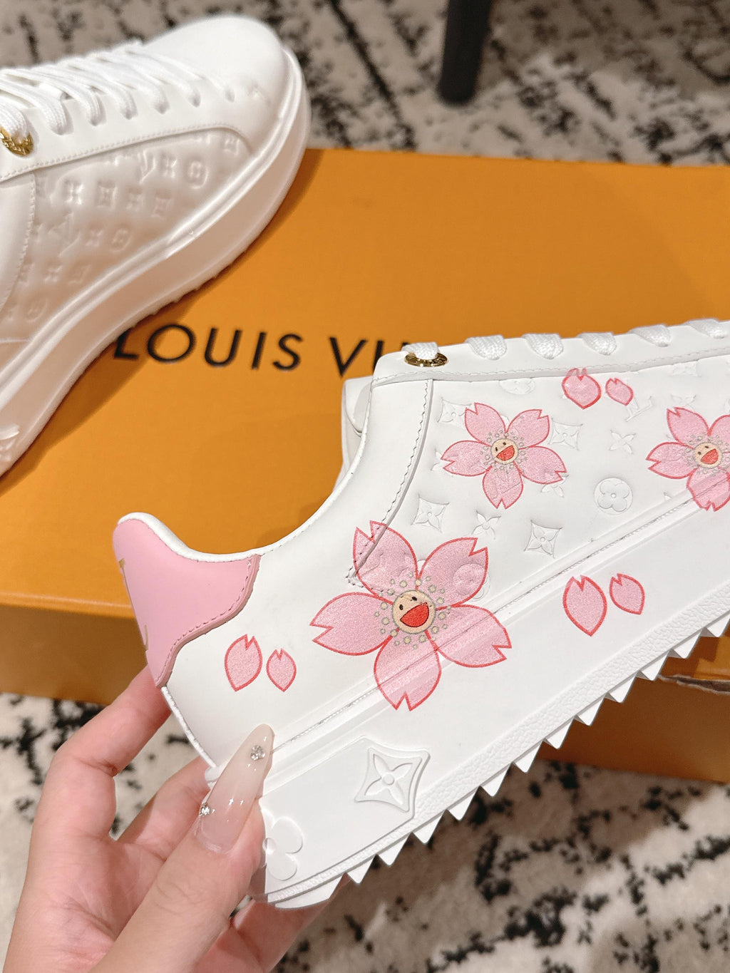 Louis Vuitton white slip-on style sneakers with pink floral print and heart emblem sole
