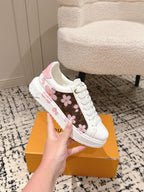 Louis Vuitton white low-top sneakers with pink floral side stripe