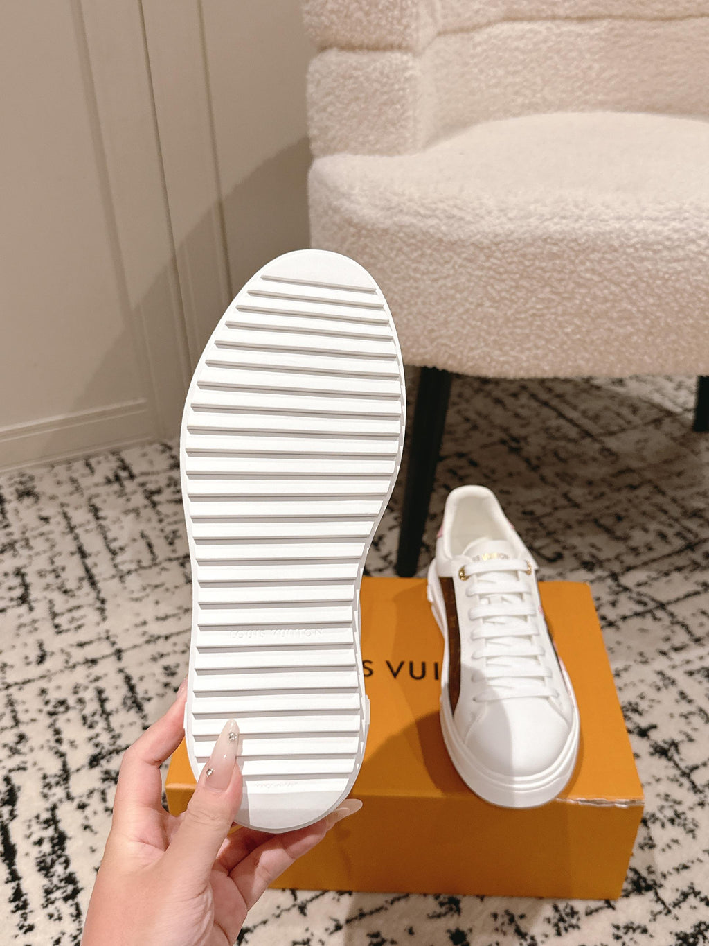 Louis Vuitton white low-top sneakers, striped outsole view