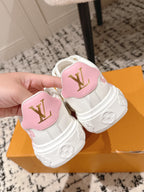 Louis Vuitton white low-top sneakers with pink heel patches and flower accents