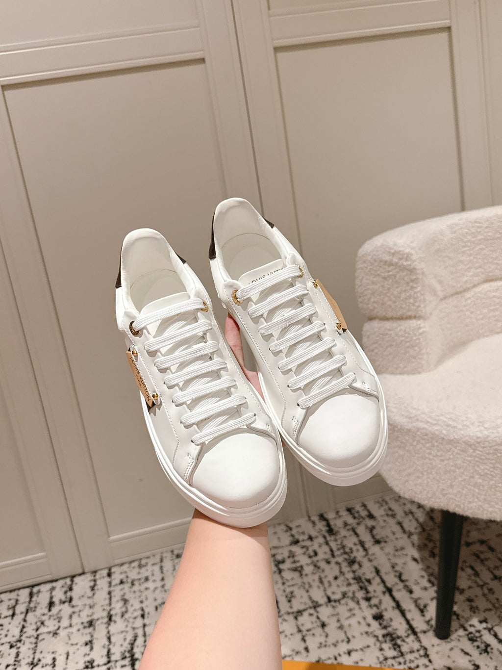 White lace-up low-top sneakers with smooth leather upper and white laces