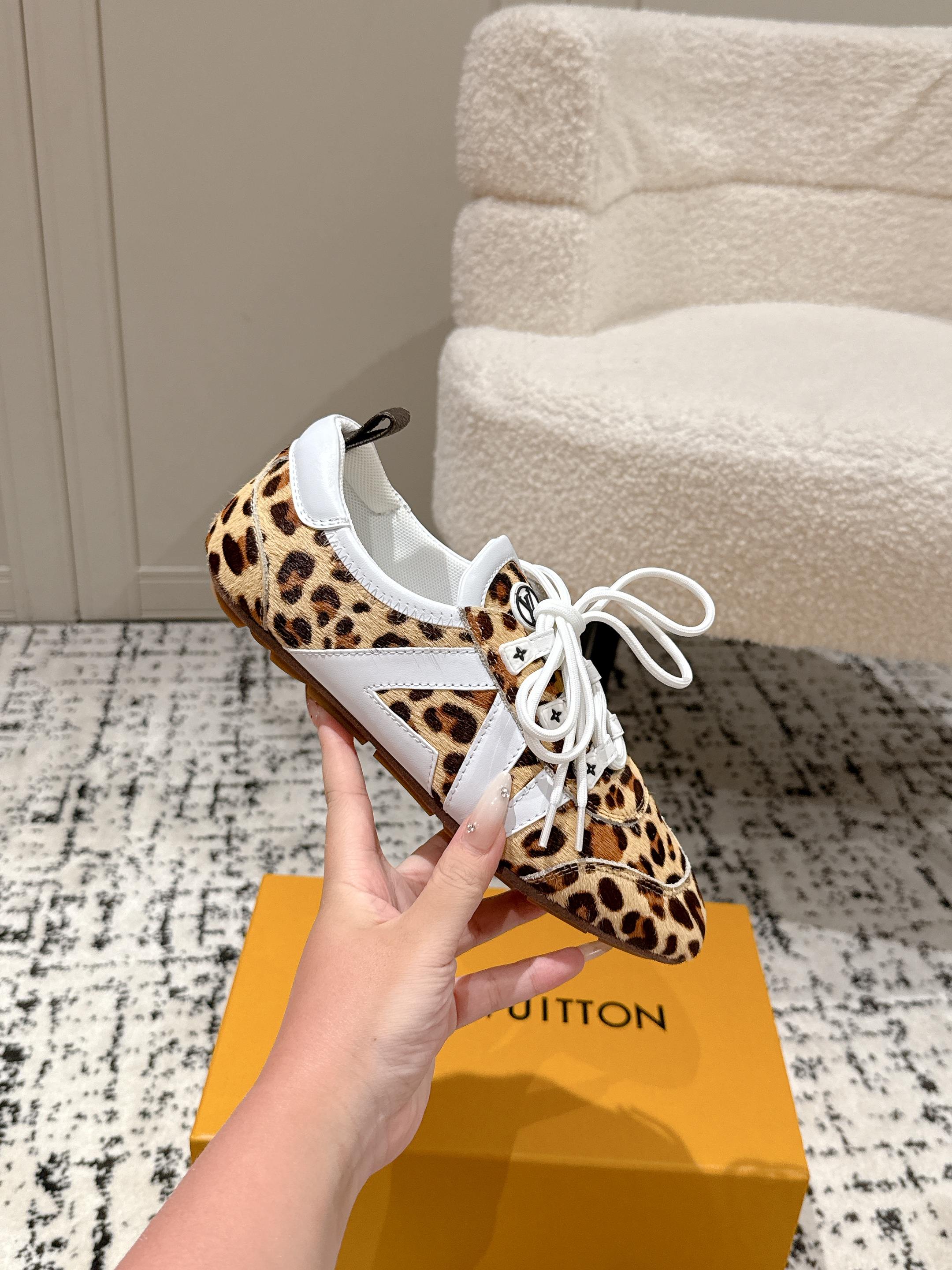 Leopard-print low-top sneaker with white laces and contrast white toe panel