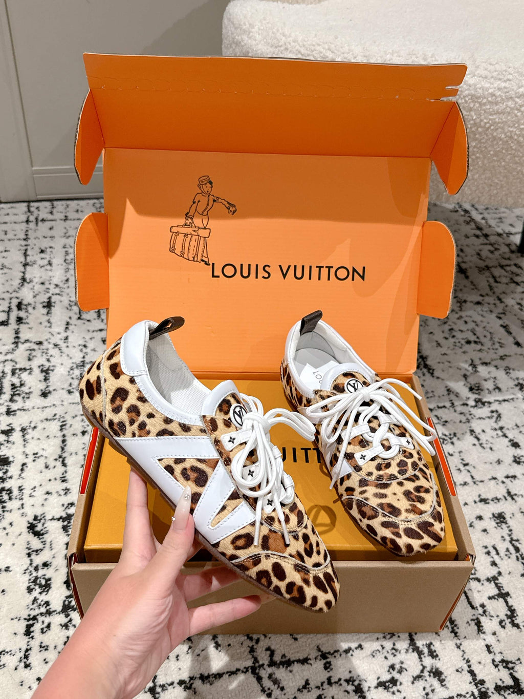 Leopard-print low-top sneakers with white laces and white logo tongue patch