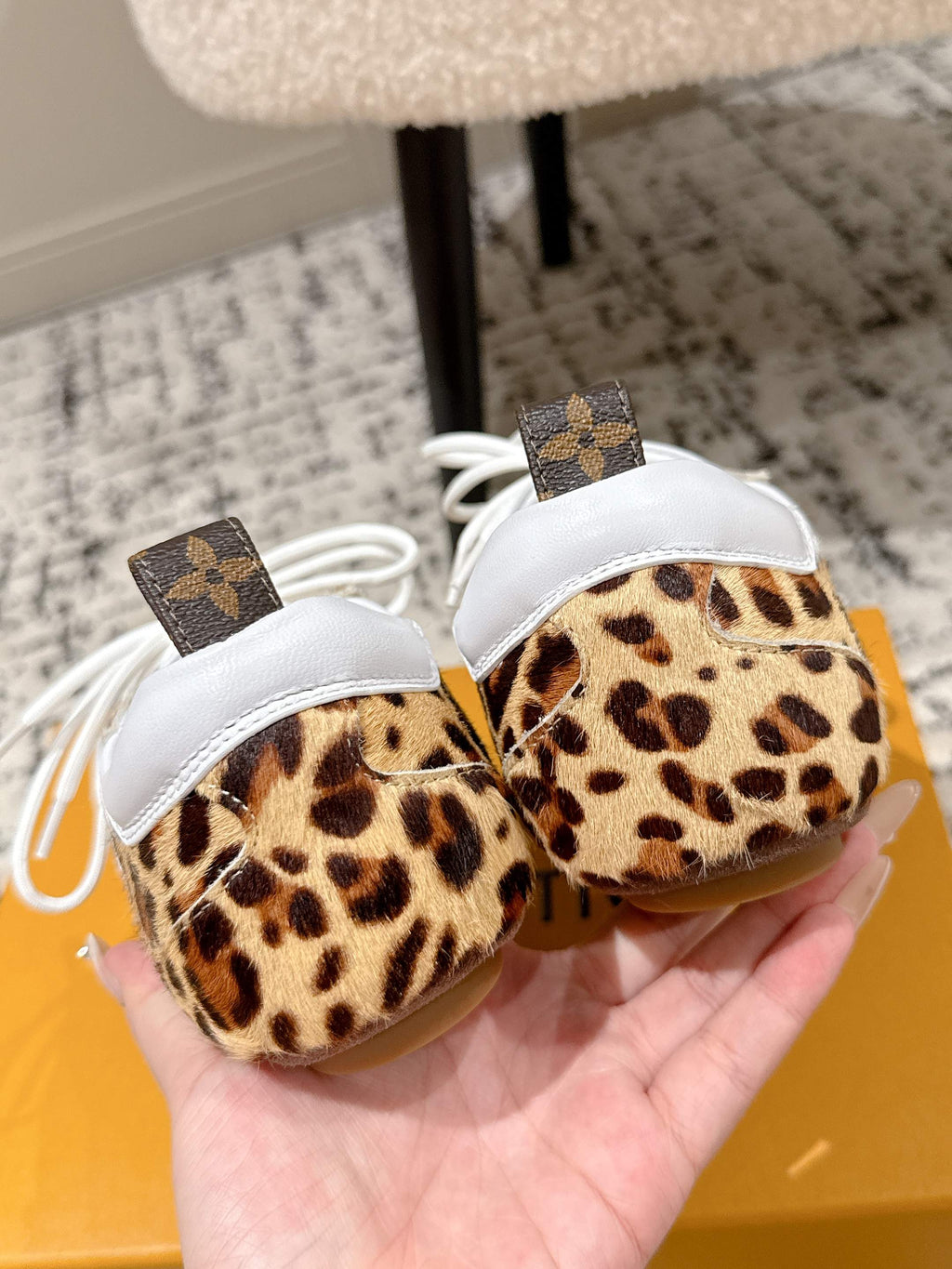 Leopard-print low-top sneakers with white laces and monogram strap details