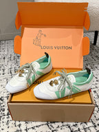 White sneakers with mint green stripe, gold charm on laces, in Louis Vuitton box