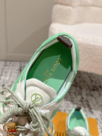 Unisex Louis Vuitton sneaker interior close-up, mint green lining and gold emblem