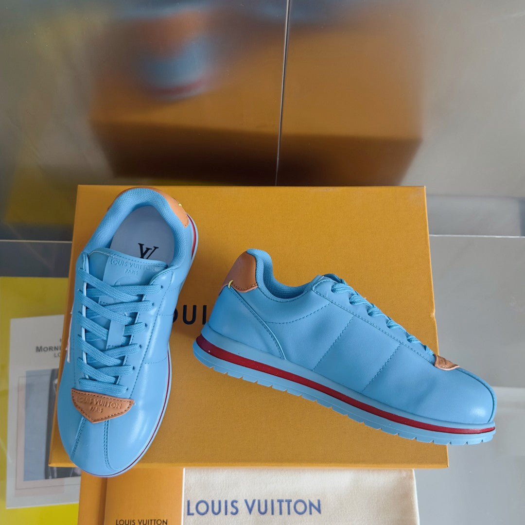 Light blue Louis Vuitton unisex sneakers with LV side logo and red-trimmed rubber sole