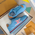 Light blue Louis Vuitton unisex sneakers with colorful LV emblem and red/blue stripe sole