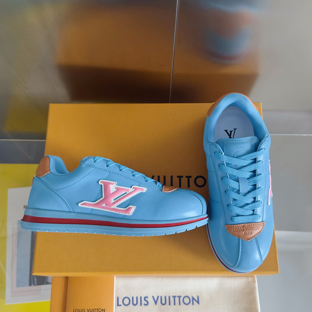 Light blue Louis Vuitton unisex sneakers with LV logo, laces, and brown heel patch
