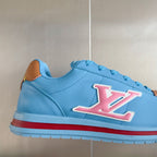 Light blue Louis Vuitton unisex sneakers with pink LV side emblem and brown heel tab
