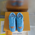 Light blue Louis Vuitton unisex sneakers with lace-up front and brown heel tabs