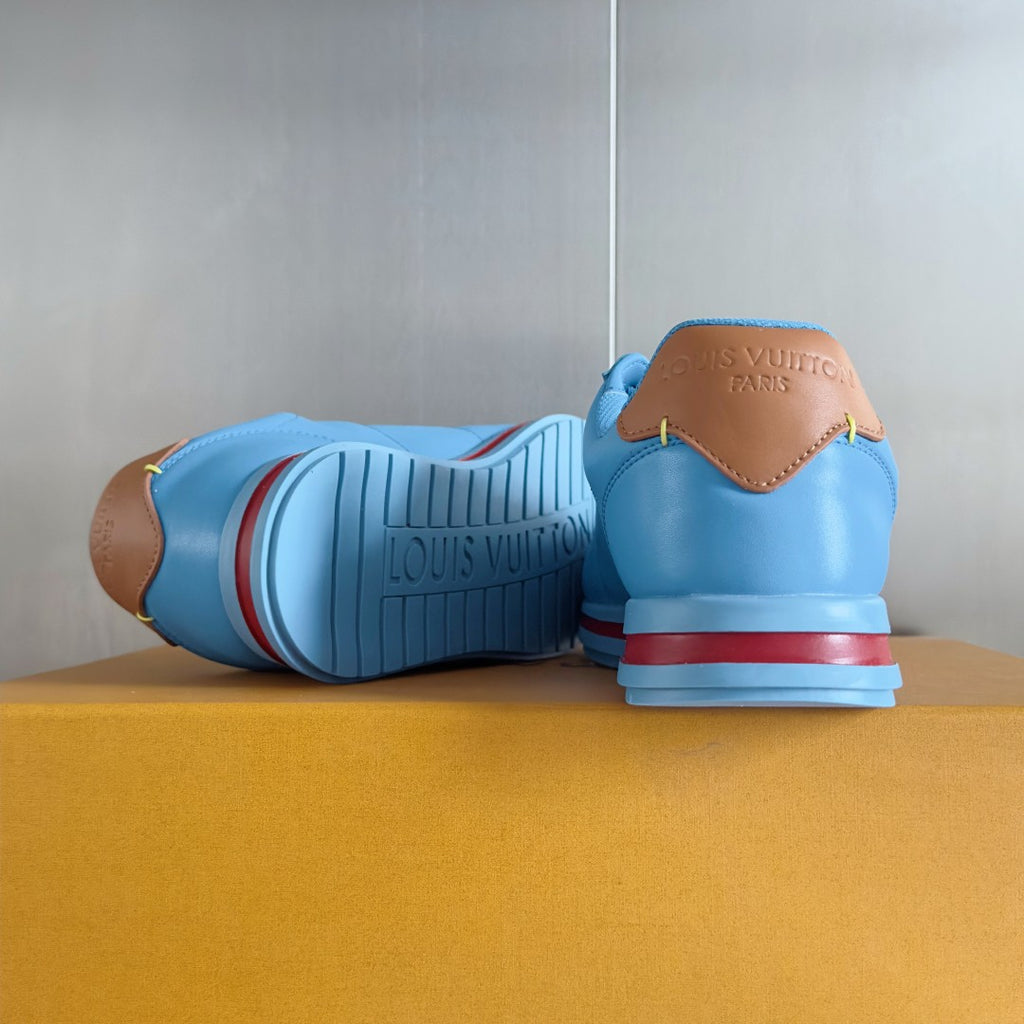 Light blue Louis Vuitton unisex sneakers with rear branding and striped rubber outsole