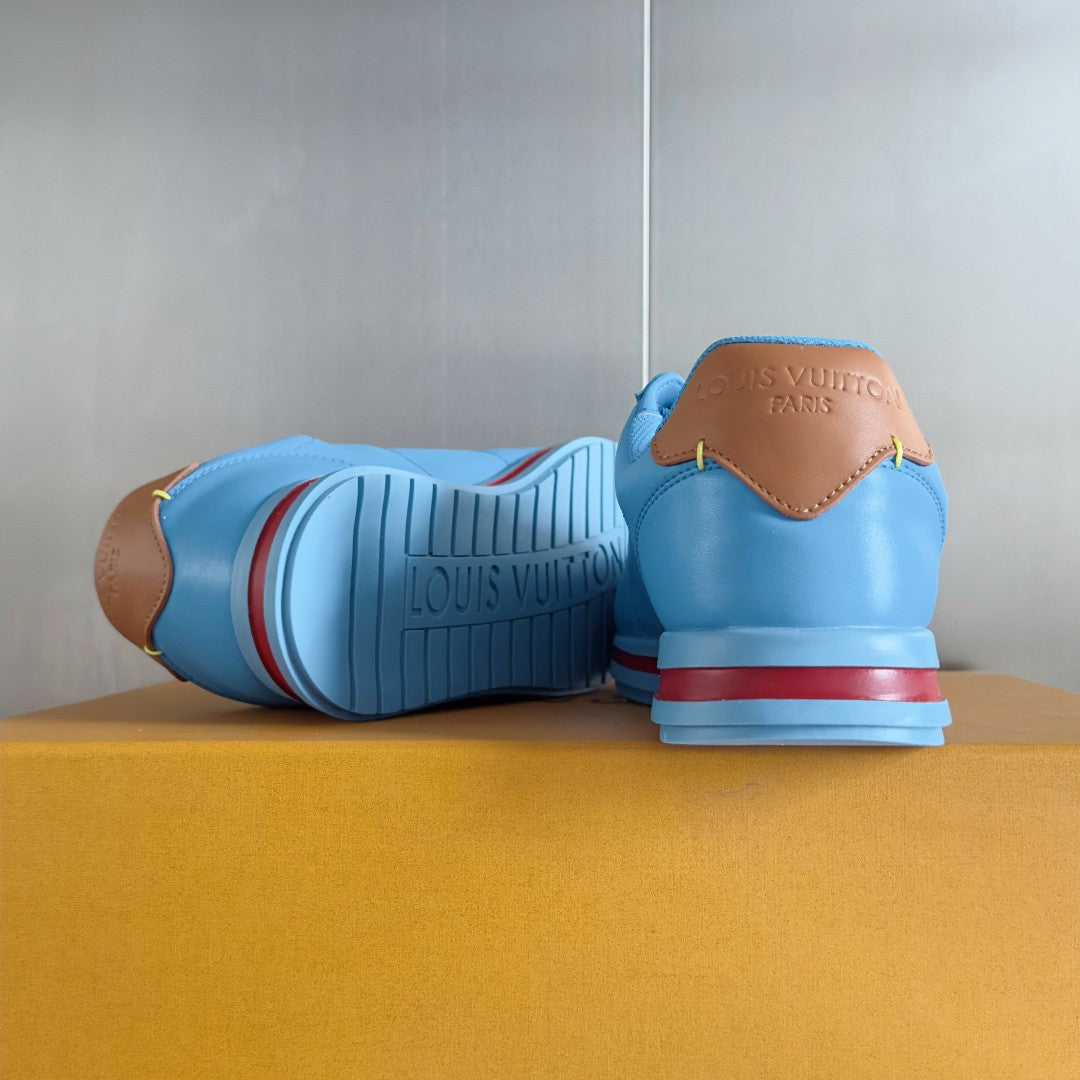 Light blue Louis Vuitton unisex sneakers with rear branding and striped rubber outsole