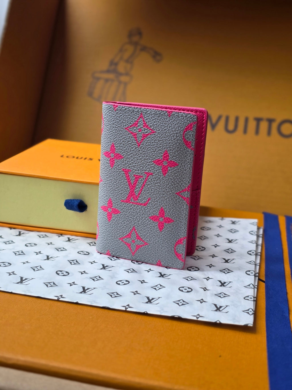 Small pink patterned card holder with fold-over flap and decorative motif print