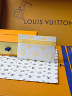 Louis Vuitton small bag with light blue monogram print and yellow edge trim, angled front