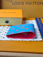 Small card wallet folded open, blue exterior with red fold and interior lining.