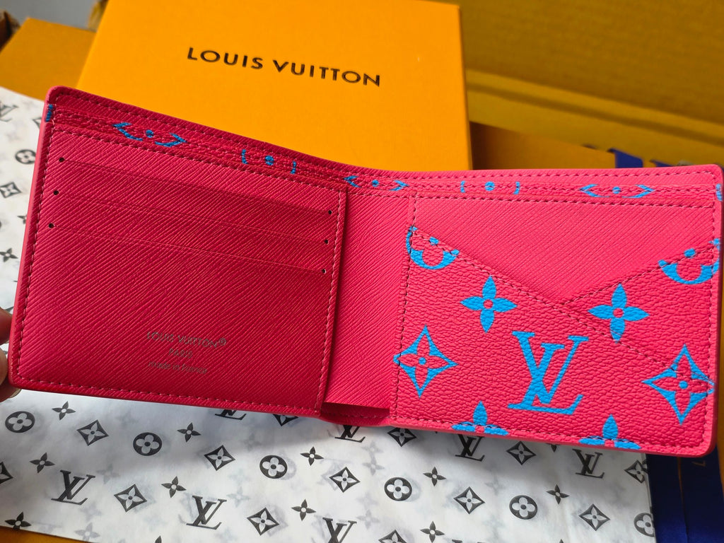 Small card wallet interior view with multiple card slots and red lining.