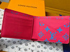 Small card wallet interior view with multiple card slots and red lining.